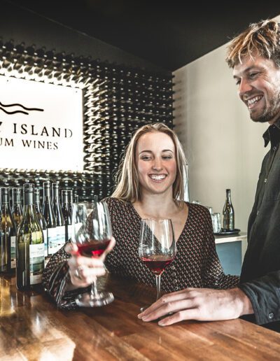Woman and man enjoy wine tasting of red wine at Bruny Island Premium Wines