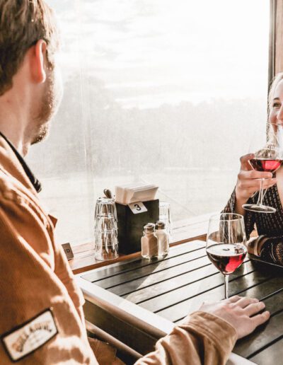 A man and woman enjoying red wine at Bruny Island Premium Wines